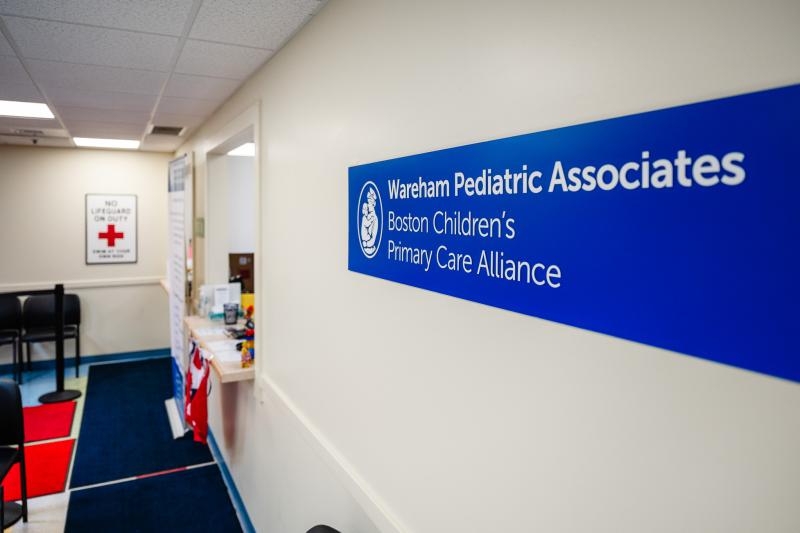 wall with sign that says wareham pediatric associates